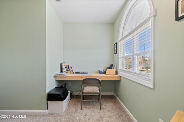 carpeted office with baseboards