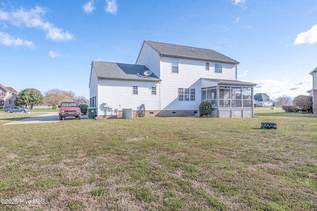 back of house featuring a yard, a sunroom, central air condition unit, and crawl space