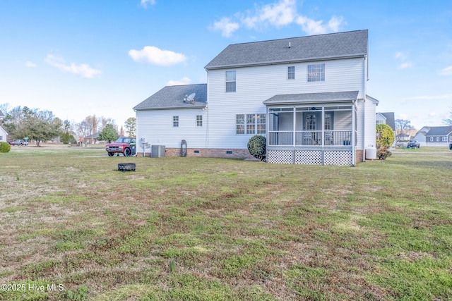 back of property featuring crawl space, a yard, cooling unit, a sunroom, and a shingled roof