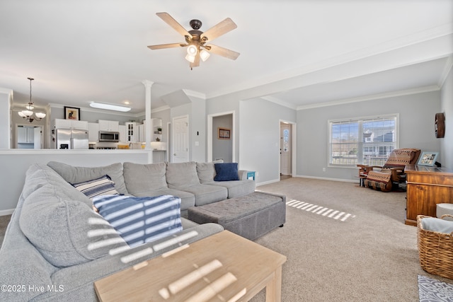 living area with a ceiling fan, baseboards, ornamental molding, and light colored carpet