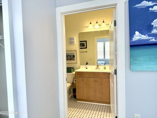 bathroom featuring toilet and vanity