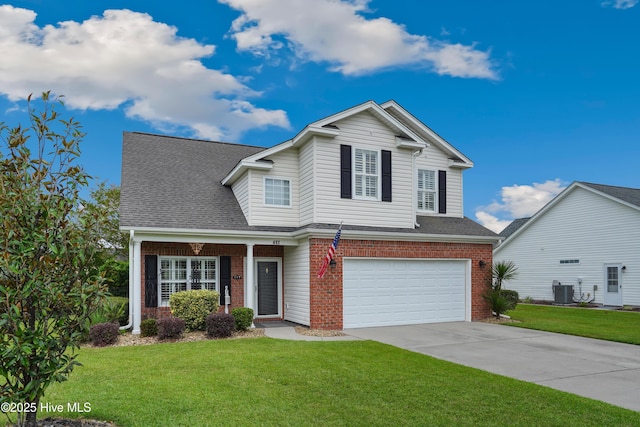 417 Pennington Loop, Myrtle Beach, SC 29588 - traditional-style home with brick siding, an attached garage, driveway, and a front yard
