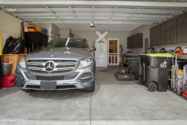 417 Pennington Loop, Myrtle Beach, SC 29588 - garage featuring a garage door opener and freestanding refrigerator