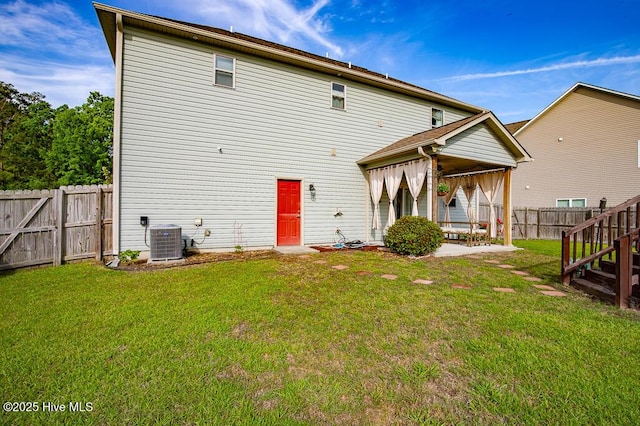 rear view of house featuring a patio and cooling unit