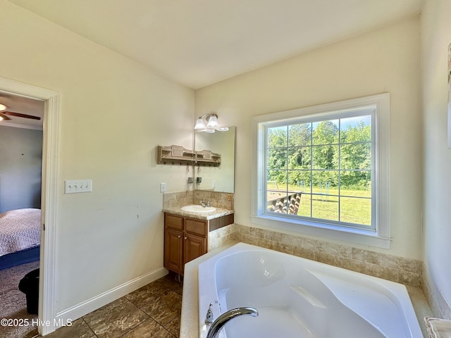 101 Pete Bunch Ln, Hobbsville, NC 27946 - full bathroom with ensuite bathroom, vanity, a garden tub, and baseboards