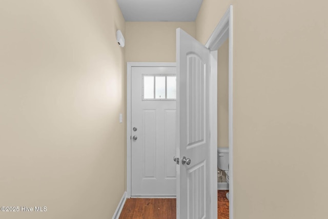 323 Frisco Way, Holly Ridge, NC 28445 - doorway to outside with baseboards and dark wood-type flooring