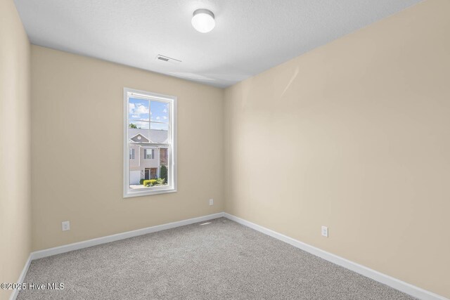 323 Frisco Way, Holly Ridge, NC 28445 - carpeted empty room featuring baseboards