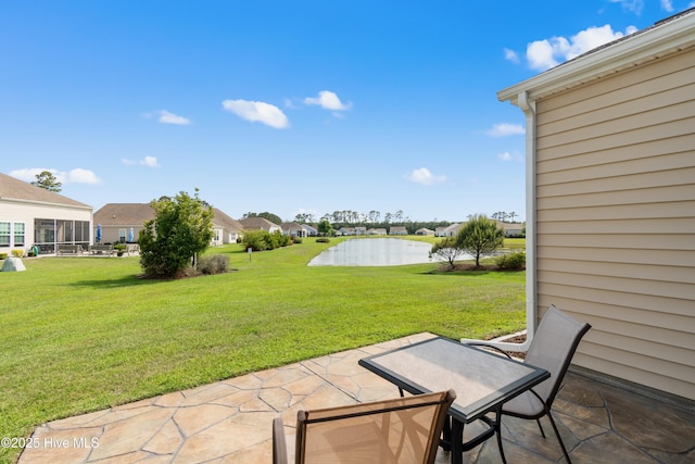 view of patio featuring a water view and a residential view