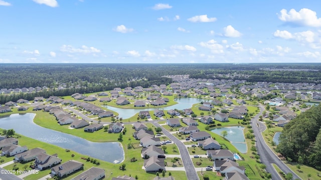 aerial view of property and surrounding area with nearby suburban area and a nearby body of water