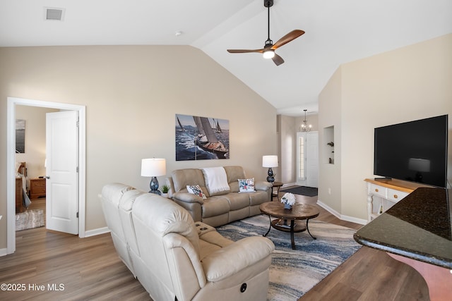 living room with a ceiling fan, wood finished floors, high vaulted ceiling, and baseboards