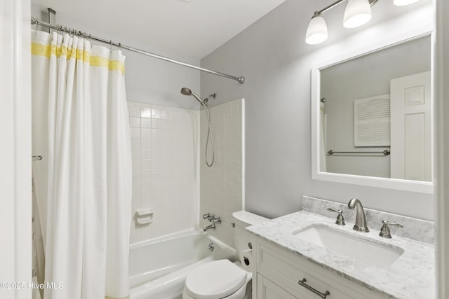 full bath with toilet, shower / tub combo, and vanity