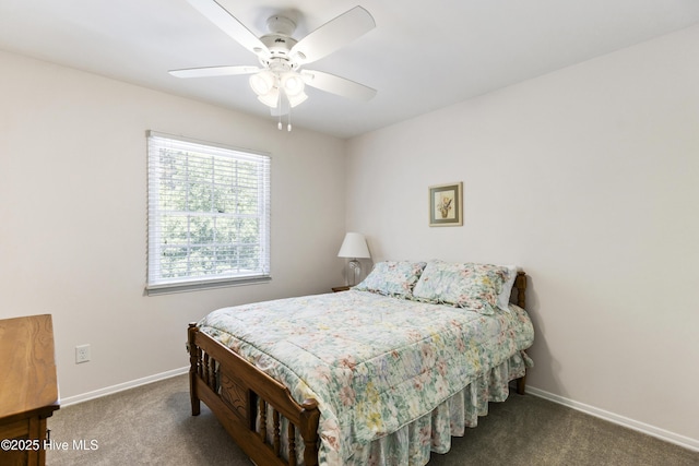 carpeted bedroom with ceiling fan and baseboards