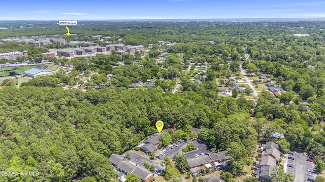 drone / aerial view with a view of trees