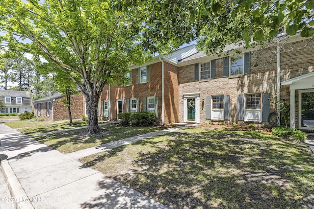 view of front of house featuring brick siding