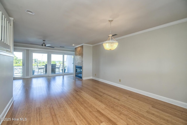 unfurnished living room featuring baseboards, crown molding, ceiling fan, light wood-style flooring, and a tile fireplace
