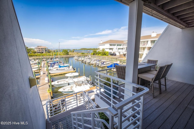 dock area featuring view of marina and a water view