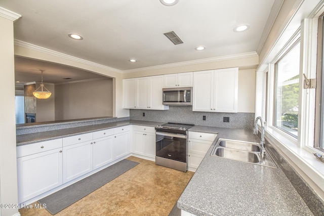 kitchen with stainless steel appliances, a sink, white cabinetry, crown molding, and tasteful backsplash