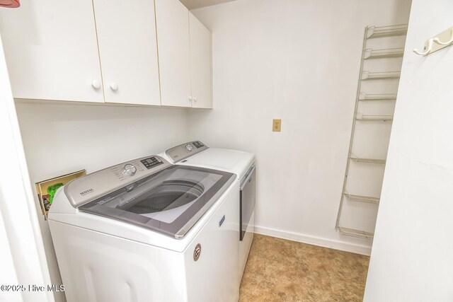 5415 Marina Club Dr, Wilmington, NC 28409 - clothes washing area featuring washer and dryer, cabinet space, and baseboards