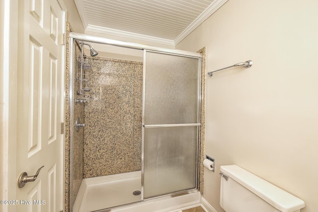 full bath with toilet, a stall shower, and ornamental molding