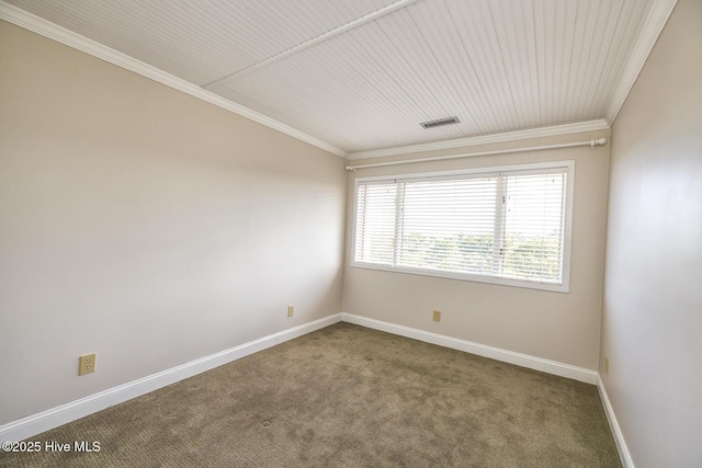carpeted empty room with crown molding and baseboards
