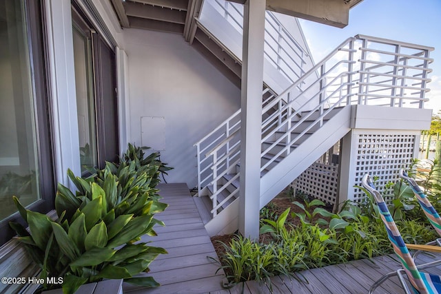 view of side of property featuring stairs