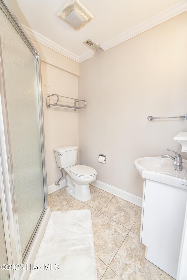 bathroom with crown molding, tile patterned floors, baseboards, and a shower with door