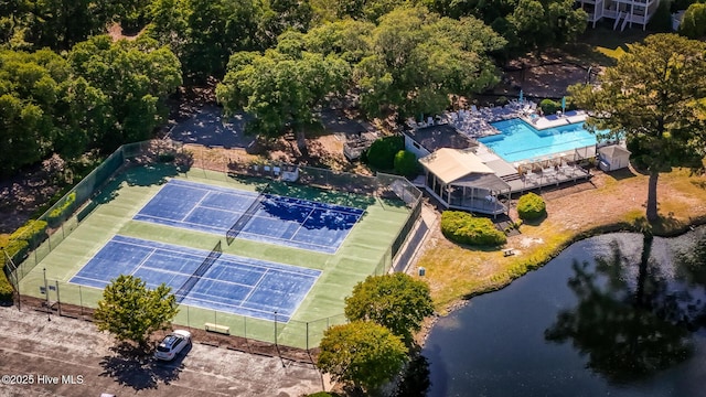 bird's eye view of a pool and a large body of water