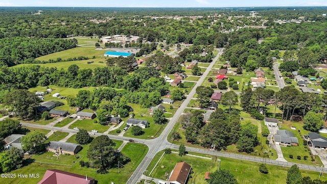 aerial view of property's location with nearby suburban area