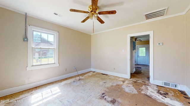 empty room with ceiling fan, ornamental molding, and baseboards