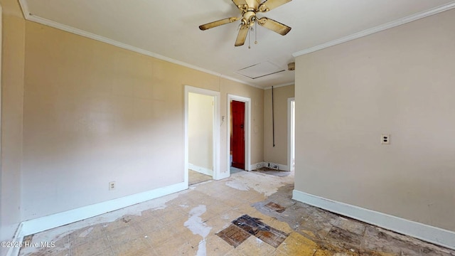 empty room featuring baseboards, ceiling fan, ornamental molding, and attic access