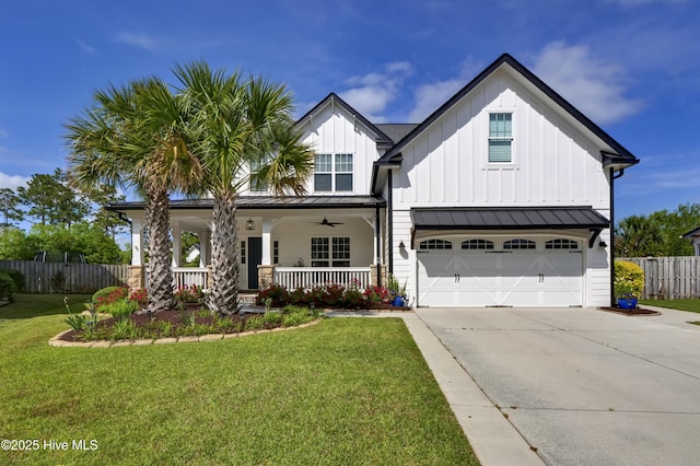 5606 Swiss Stone Ct, Wilmington, NC 28412 - modern farmhouse style home with driveway, covered porch, a garage, and board and batten siding