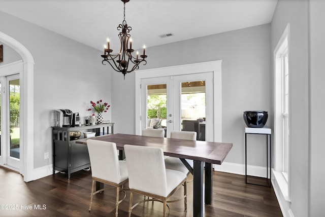 5606 Swiss Stone Ct, Wilmington, NC 28412 - dining area featuring french doors, plenty of natural light, and dark wood-type flooring