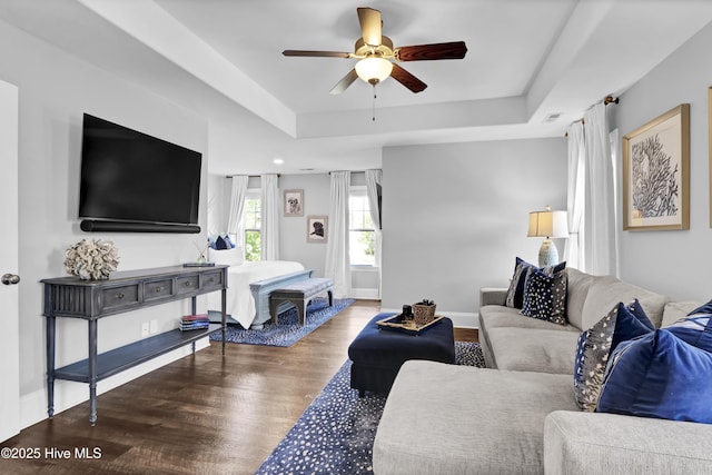 5606 Swiss Stone Ct, Wilmington, NC 28412 - living room with ceiling fan, wood finished floors, a tray ceiling, and baseboards