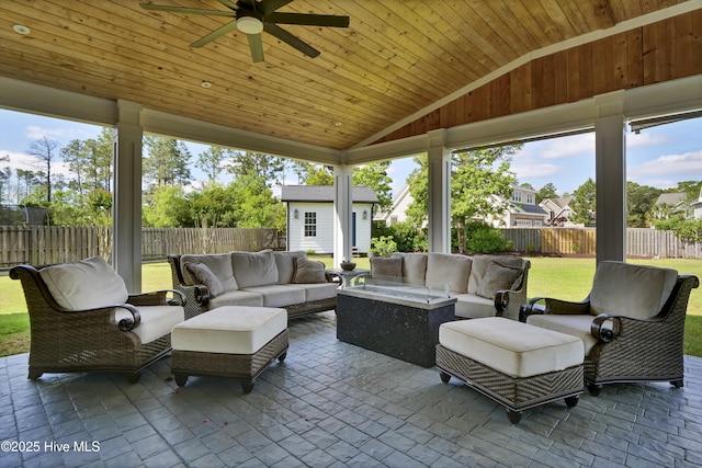 5606 Swiss Stone Ct, Wilmington, NC 28412 - sunroom with vaulted ceiling, a ceiling fan, an outdoor hangout area, and plenty of natural light
