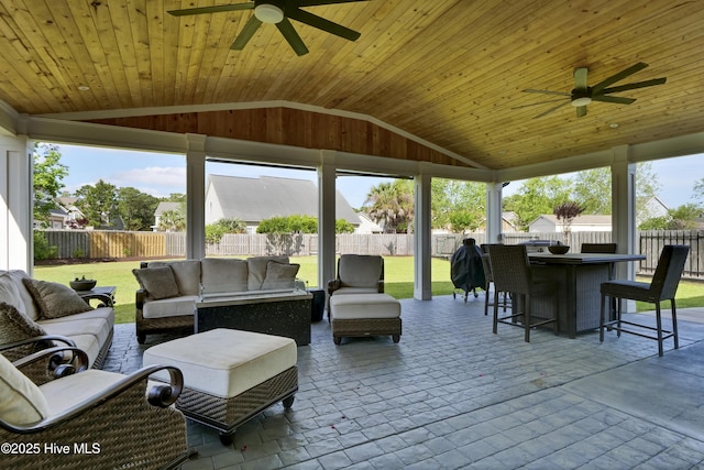 5606 Swiss Stone Ct, Wilmington, NC 28412 - sunroom with ceiling fan, an outdoor living space, and lofted ceiling