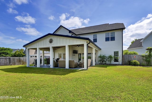 5606 Swiss Stone Ct, Wilmington, NC 28412 - back of property with ceiling fan, board and batten siding, a patio, and an outdoor living space