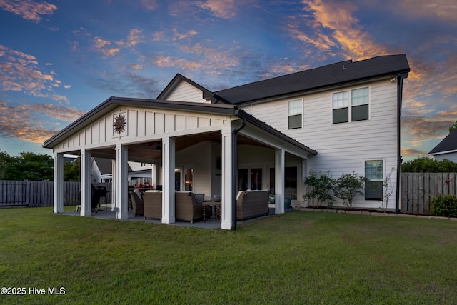 5606 Swiss Stone Ct, Wilmington, NC 28412 - back of property featuring an outdoor living space, board and batten siding, and a patio