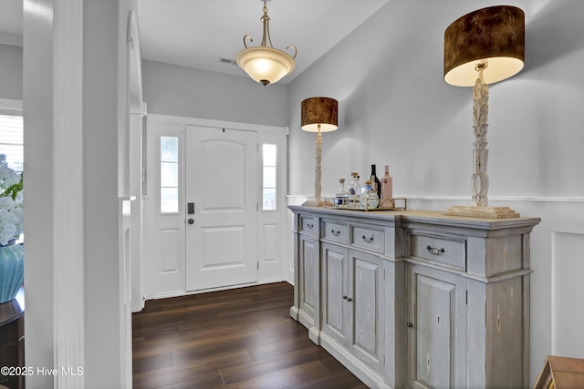 5606 Swiss Stone Ct, Wilmington, NC 28412 - entryway with dark wood-style floors, plenty of natural light, and a dry bar