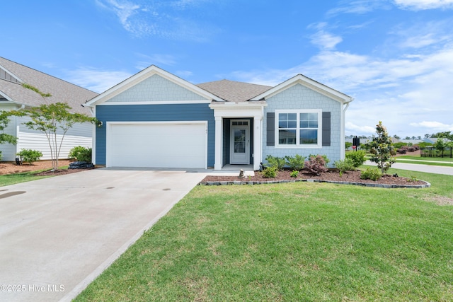 single story home with a garage, driveway, and a front yard