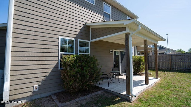 view of side of home featuring a patio area
