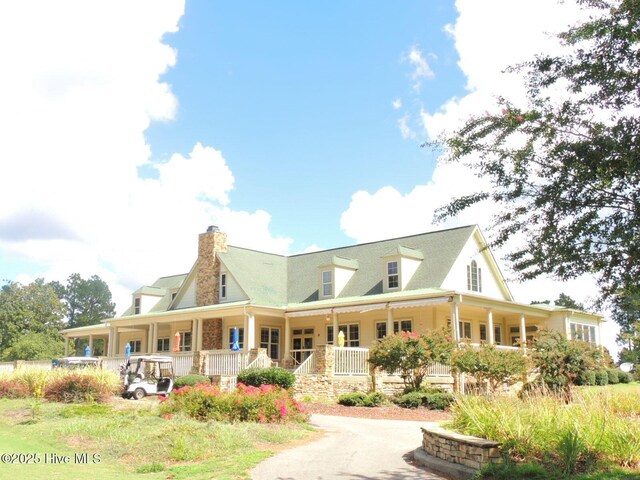 1 Eliot Ct, Jackson Springs, NC 27281 - view of front of house featuring covered porch and a chimney