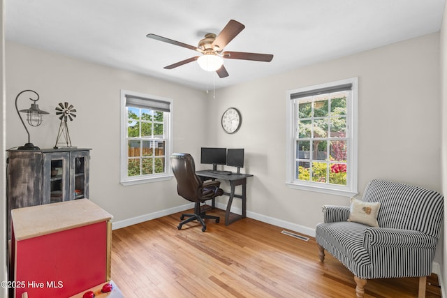 113 S Canal St, Whiteville, NC 28472 - office area with wood finished floors, baseboards, and a ceiling fan