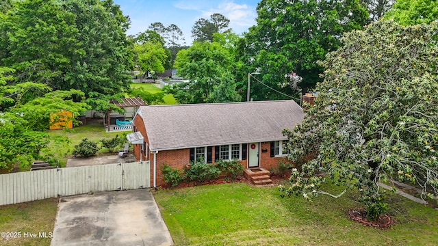 113 S Canal St, Whiteville, NC 28472 - view of front of home featuring a gate, brick siding, a shingled roof, and a chimney