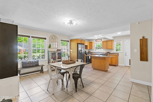 113 S Canal St, Whiteville, NC 28472 - dining space with light tile patterned floors and baseboards