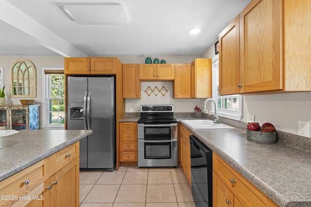 113 S Canal St, Whiteville, NC 28472 - kitchen with appliances with stainless steel finishes, a sink, healthy amount of natural light, light tile patterned floors, and recessed lighting