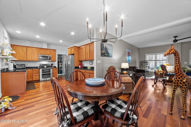 171 Adams Ln, Washington, NC 27889 - dining space featuring light wood-style floors, recessed lighting, vaulted ceiling, ceiling fan, and a chandelier