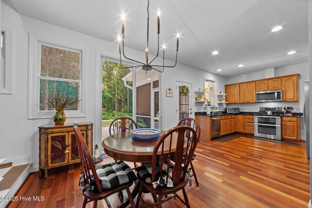 171 Adams Ln, Washington, NC 27889 - dining space with dark wood-type flooring, recessed lighting, a chandelier, and baseboards