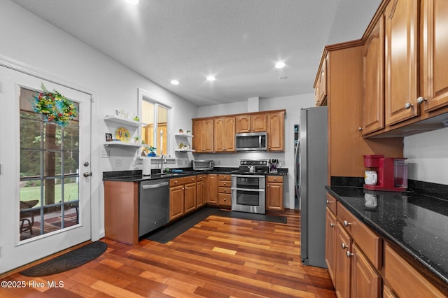 171 Adams Ln, Washington, NC 27889 - kitchen with stainless steel appliances, open shelves, recessed lighting, brown cabinetry, and dark wood finished floors