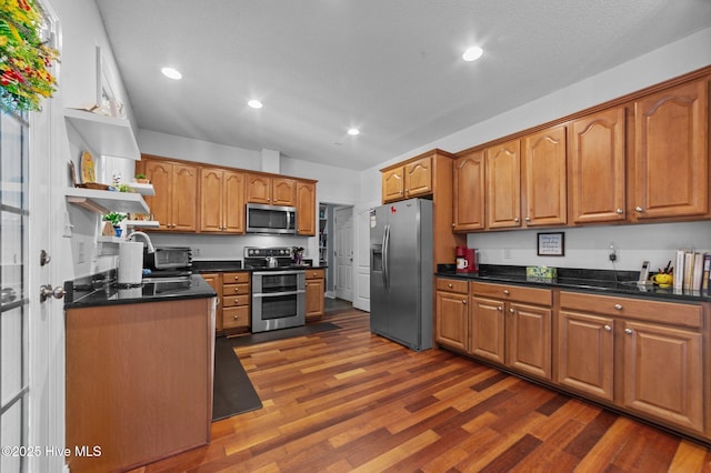 171 Adams Ln, Washington, NC 27889 - kitchen featuring appliances with stainless steel finishes, open shelves, dark countertops, dark wood-type flooring, and recessed lighting