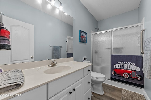 171 Adams Ln, Washington, NC 27889 - full bath featuring wood finished floors, a shower stall, vanity, and toilet